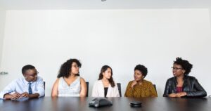 Diverse professionals collaborating in a meeting in a modern office, illustrating B2B marketing in Singapore.