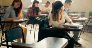 University students studying together in a bright classroom, illustrating education marketing in Singapore.