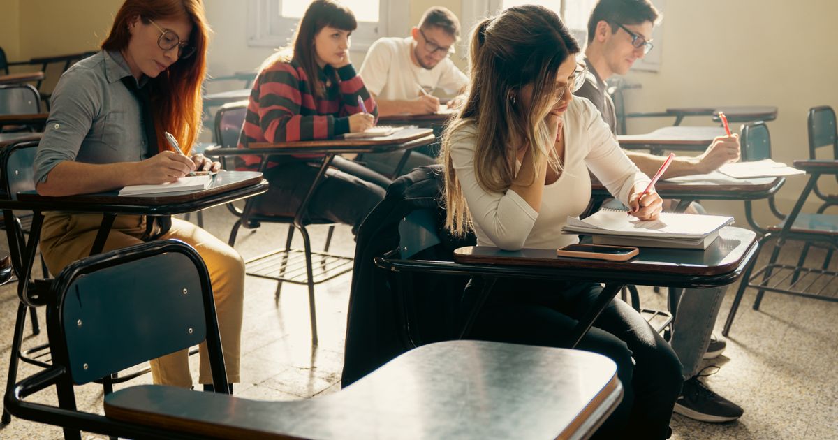 University students studying together in a bright classroom, illustrating education marketing in Singapore.