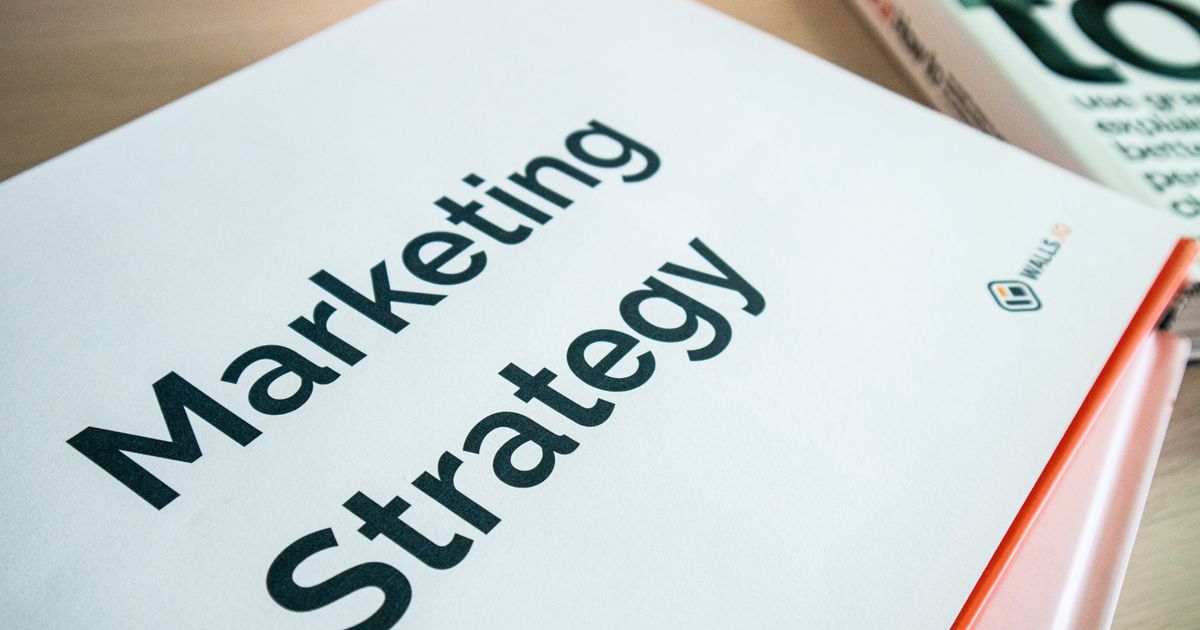 Marketing strategy document on a desk, representing choosing between Google Ads campaign types