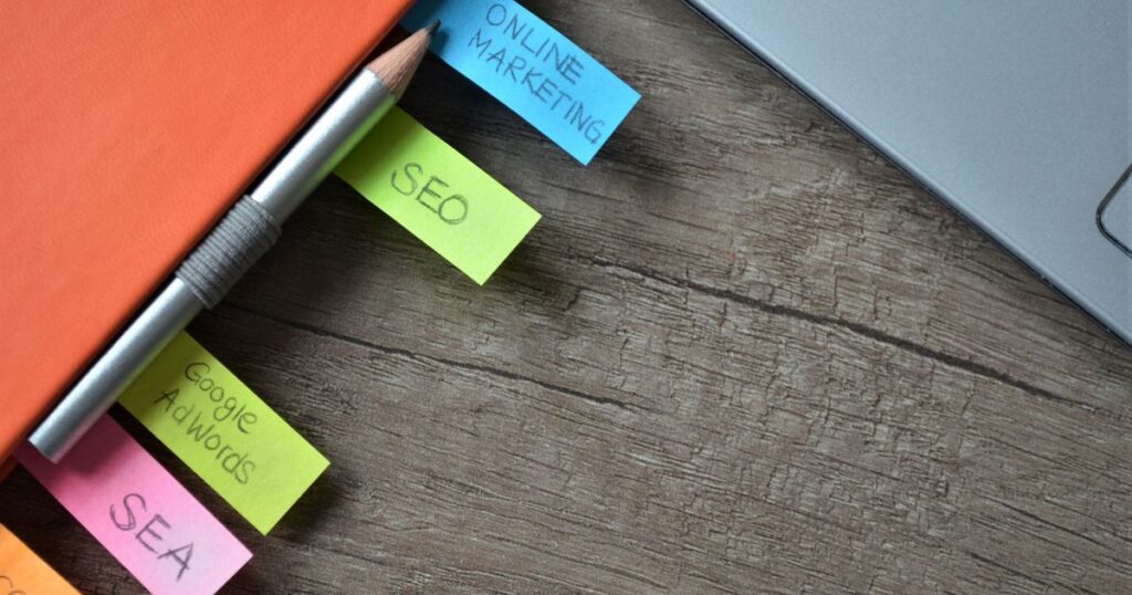 Keyword planner with colourful sticky notes and a pencil, representing Google Ads keyword match types