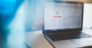 Laptop displaying an analytics dashboard in a modern workspace, representing Google Search Console setup