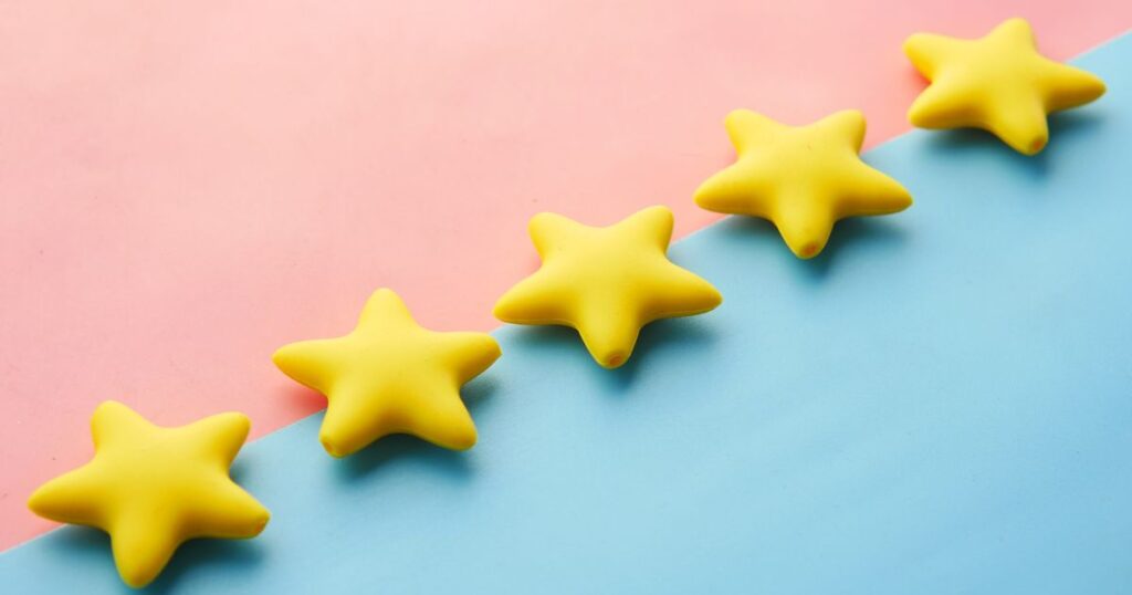 Yellow stars on a pastel background, representing customer ratings and Google reviews
