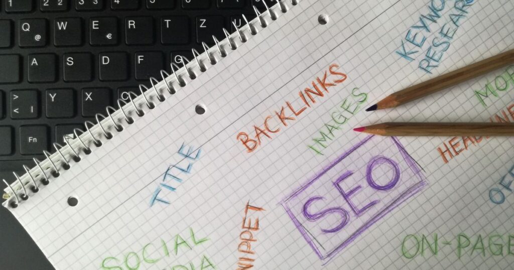 Notebook filled with SEO terms and keywords, representing keyword research