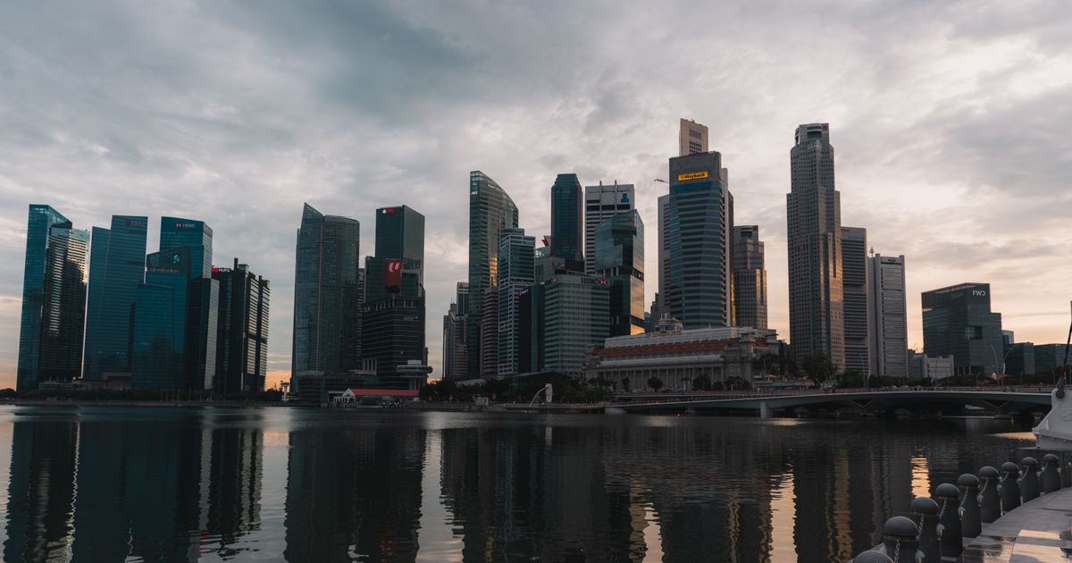 Singapore skyline reflected on the waterfront at dusk, representing local search visibility for Singapore businesses