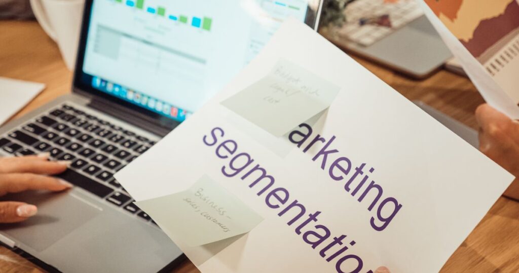 Marketer analysing campaign performance data on a laptop while diagnosing Meta ad delivery.