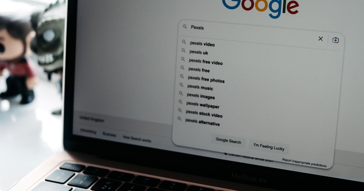 A laptop screen showing a Google search results page, representing search advertising demand capture