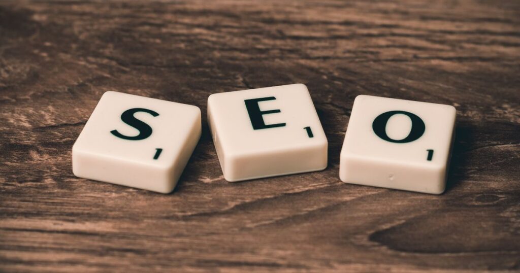 Scrabble tiles spelling SEO on a wooden surface, representing search engine optimisation in Singapore