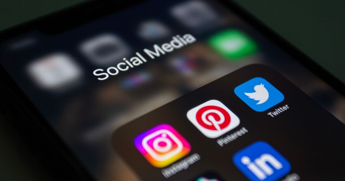 Smartphone screen showing social media apps including Instagram and TikTok, illustrating social media management in Singapore.