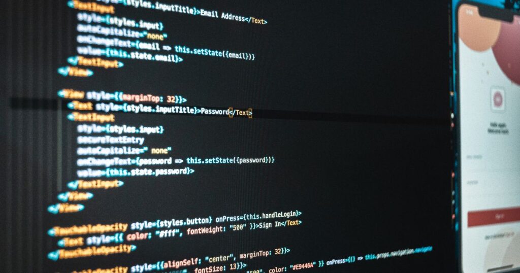 Computer screen showing program code in a modern workplace, representing technical SEO work