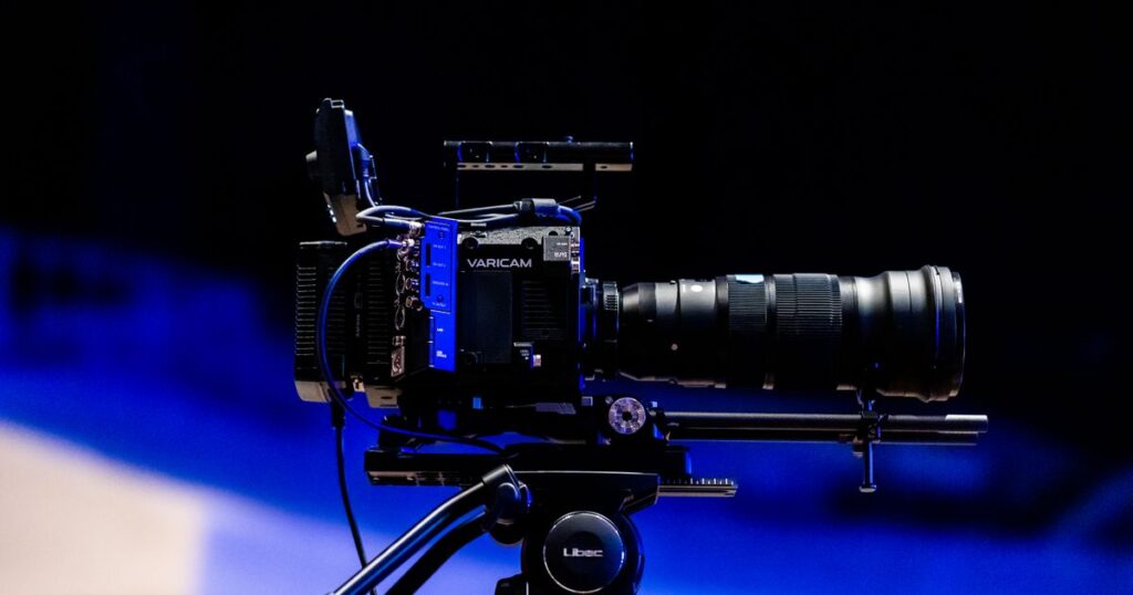 Professional video camera on a tripod, representing YouTube video advertising