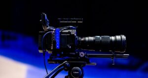 Professional video camera on a tripod, representing YouTube video advertising