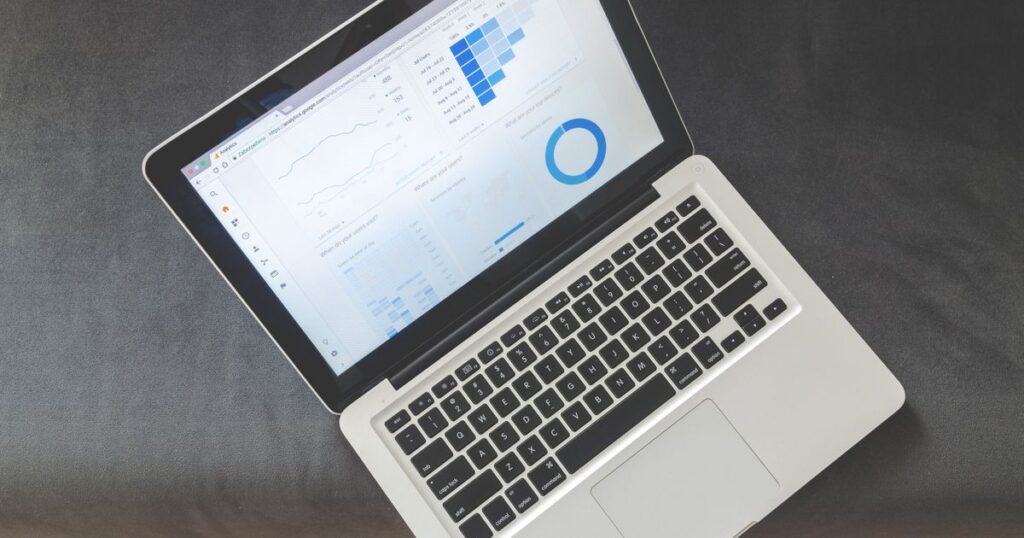 Laptop screen showing a website analytics dashboard of the kind an AI SEO audit tool reports against