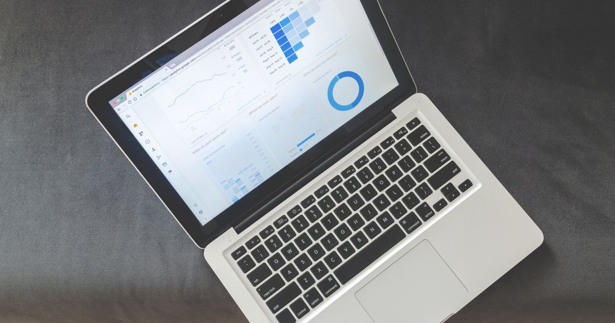 Laptop screen showing a website analytics dashboard of the kind an AI SEO audit tool reports against