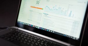 Laptop screen showing a live web analytics dashboard with traffic charts