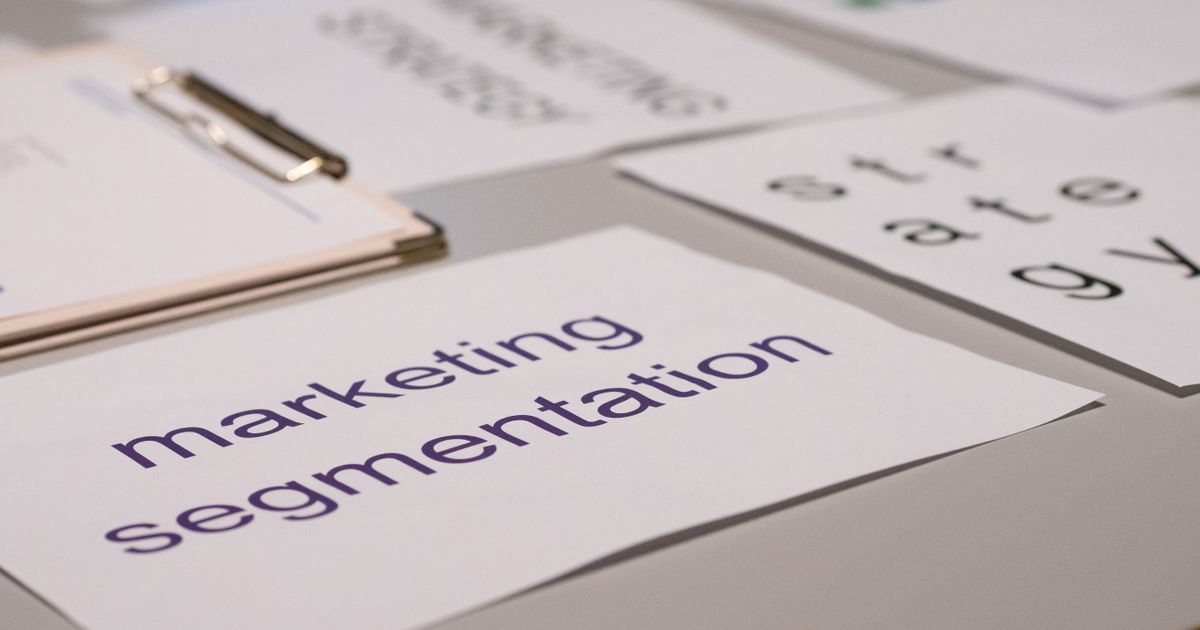 Marketing strategy documents spread across a desk during content planning.