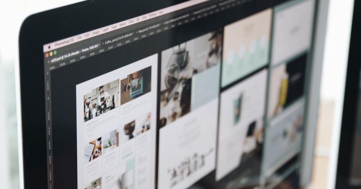 A computer screen showing several web page designs laid out side by side in a design application