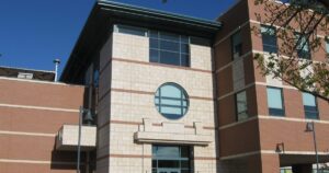 Classroom building on a college campus, illustrating the premises a private education institution must accurately represent in its advertising