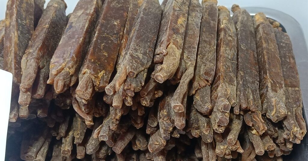 A tray of dried ginseng roots, a common traditional Chinese medicine ingredient, illustrating the rules on advertising TCM clinics in Singapore.