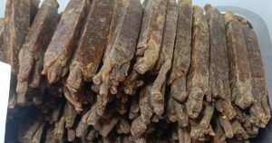A tray of dried ginseng roots, a common traditional Chinese medicine ingredient, illustrating the rules on advertising TCM clinics in Singapore.