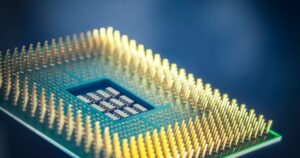 Macro shot of a computer processor chip with gold pins against a blue background, illustrating how Singapore advertising and consumer-protection rules treat AI-powered product claims.