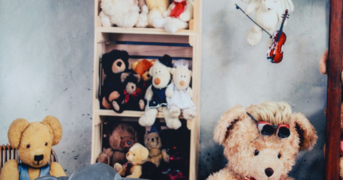 Shelves of teddy bears and plush toys on a children's photo set with no people, illustrating the rules for using child models and kidfluencers in Singapore advertising.